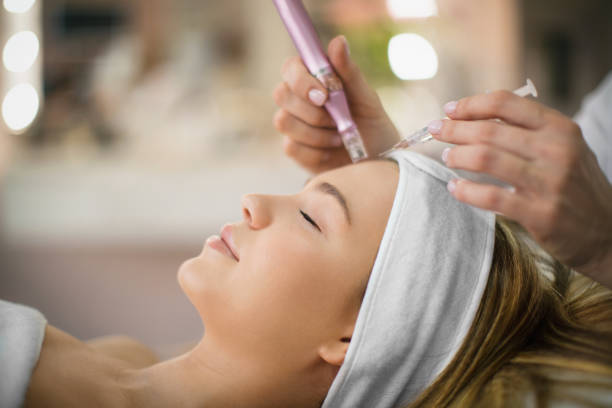 Woman receiving facial treatment in spa