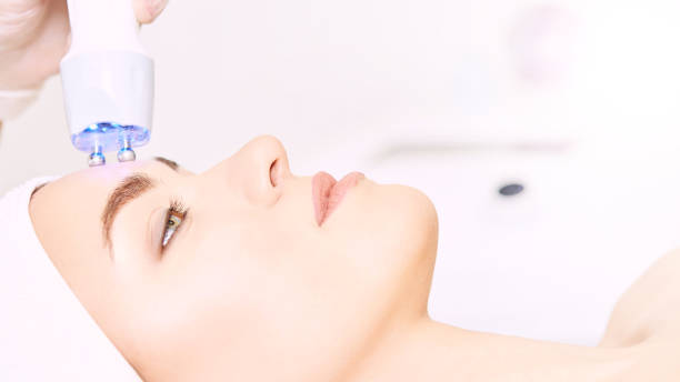 Female receiving advanced facial treatment at beauty spa